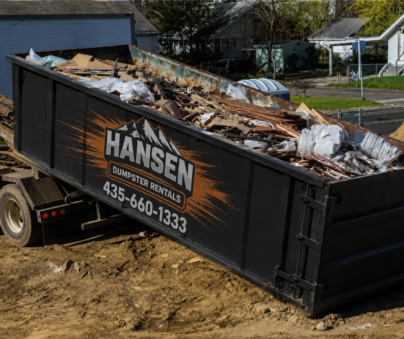 Hansen Dumpster Rentals pickup truck collecting a roll-off in Utah