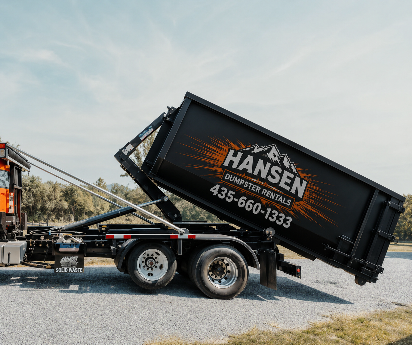 Hansen Dumpster Rentals delivering a roll-off dumpster on a Utah driveway